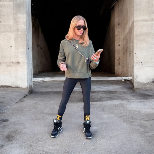 Black fabric and gold finish crossbody phone strap for hands-free phone carrying  – Disco Goat.
